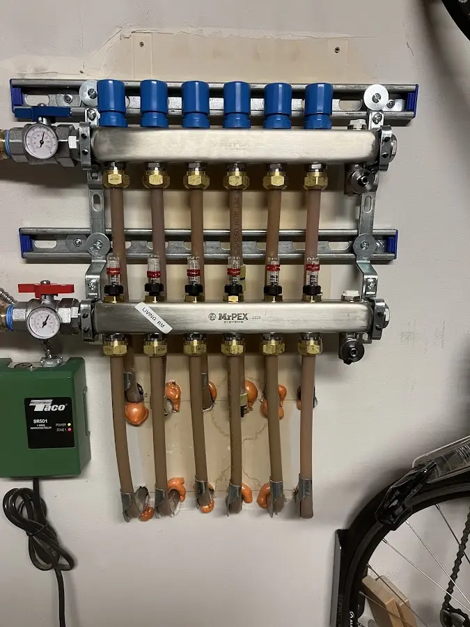 Plumber performing Water Heater Repair at a residential property in Wenham